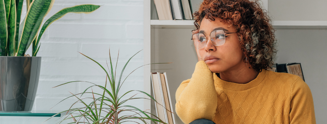 girl thinking about how to stop negative thoughts