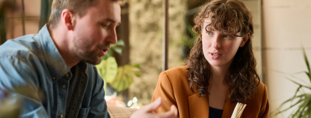 A therapist looks at her patient while he tells her his problems.
